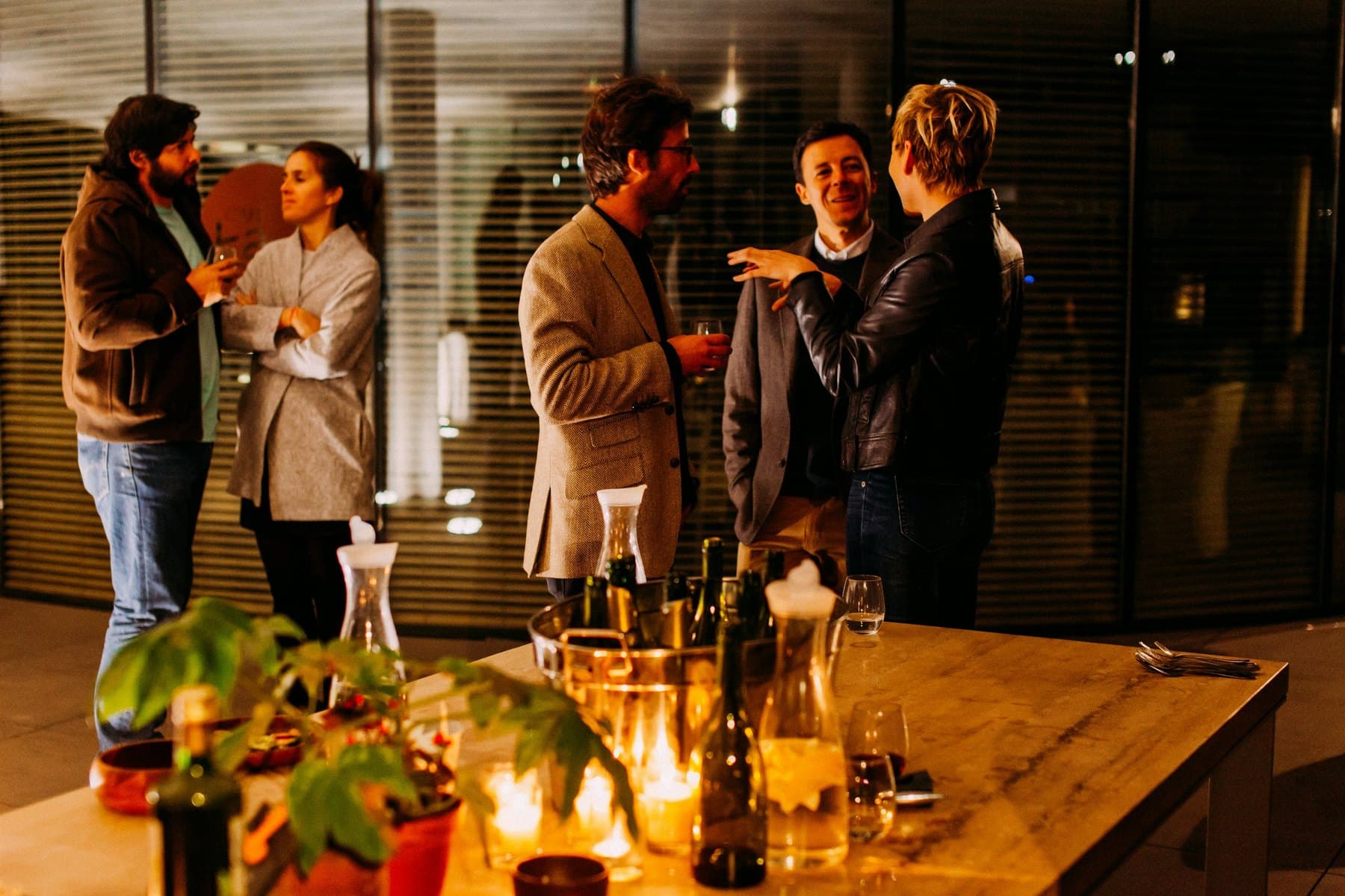 Guests in conversation at a drinks reception