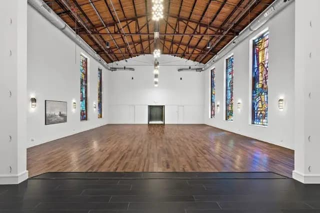 Chatelet hall with stained glass and hardwood floors